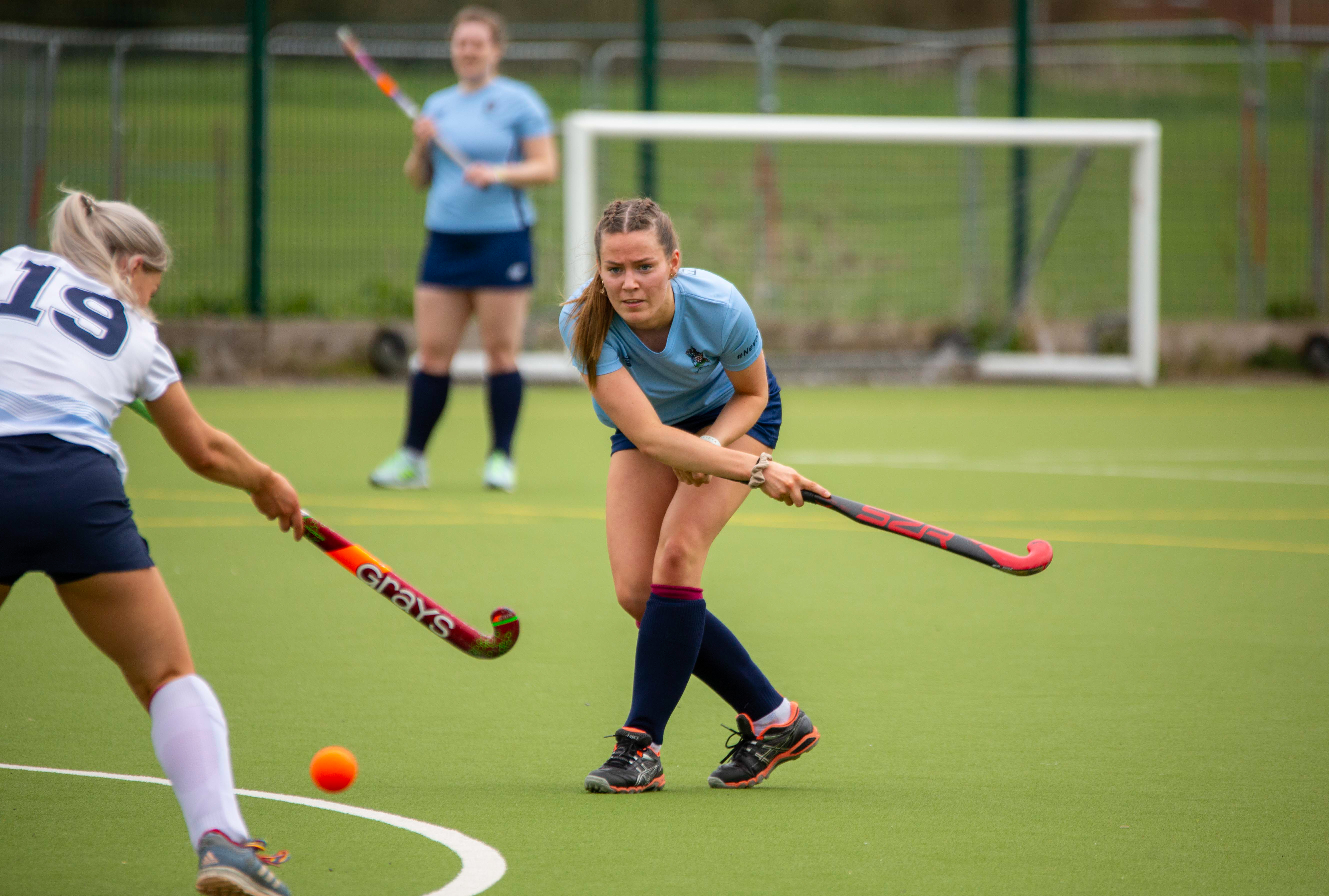 People playing hockey